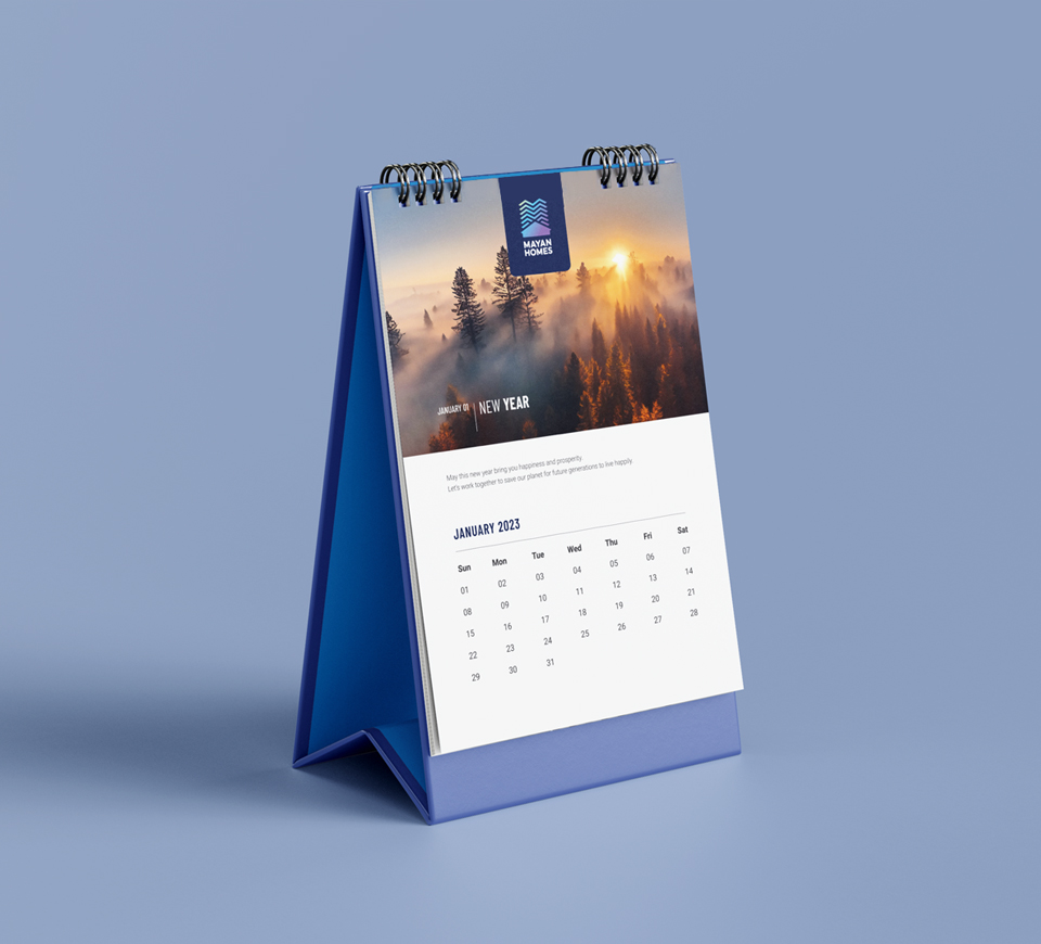 Mayan Homes  Table Calendar with tagline Building Future Lifestyle featuring gated community entrance visual